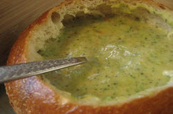 Panera Bread broccoli cheese soup recipe shows soup cooked in bread bowl t