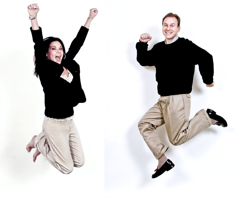 Jumping business executive man and woman in photo shot by corporate Los Angeles photographer