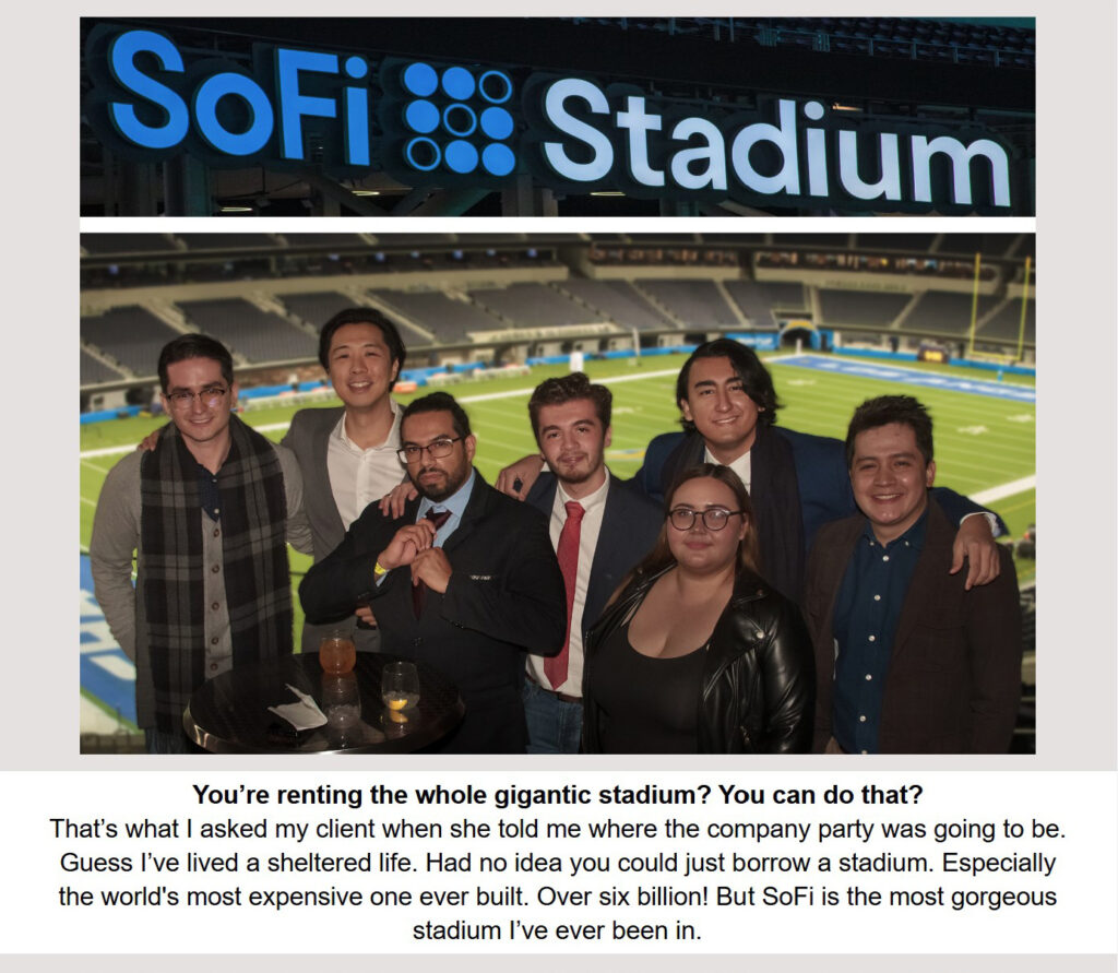 At a company party in the Los Angeles SoFi Stadium a group of happy employees smile and raise their glasses to toast