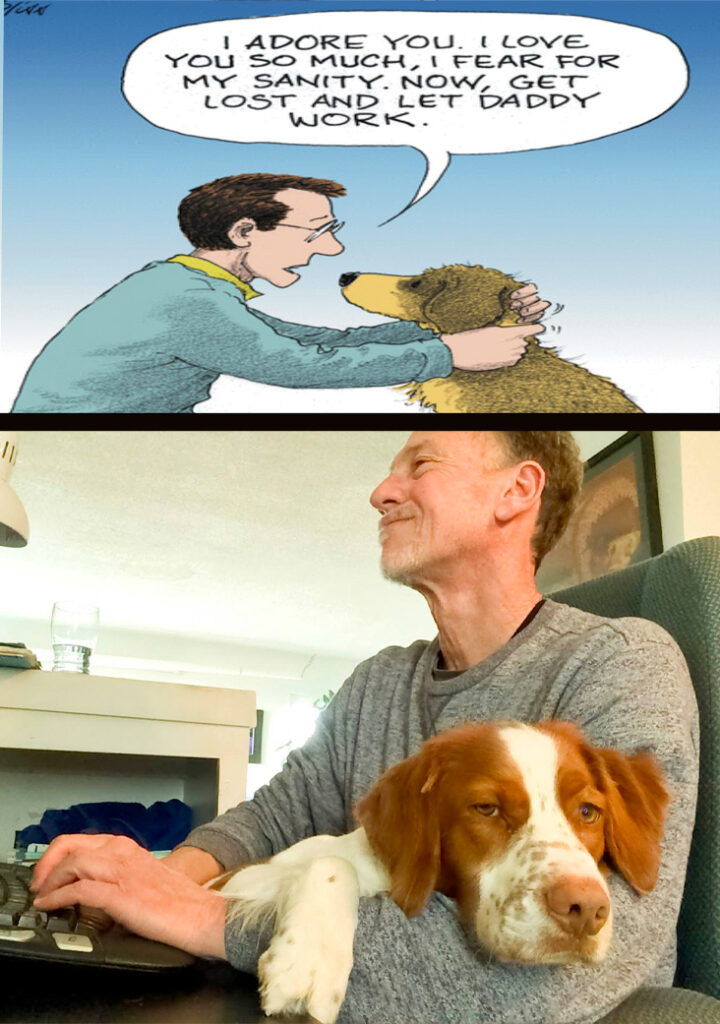 Dog laying on lap of man typing at computer