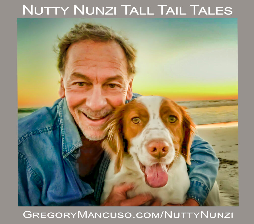 Man hugging his dog on Los Angeles beach at sunset